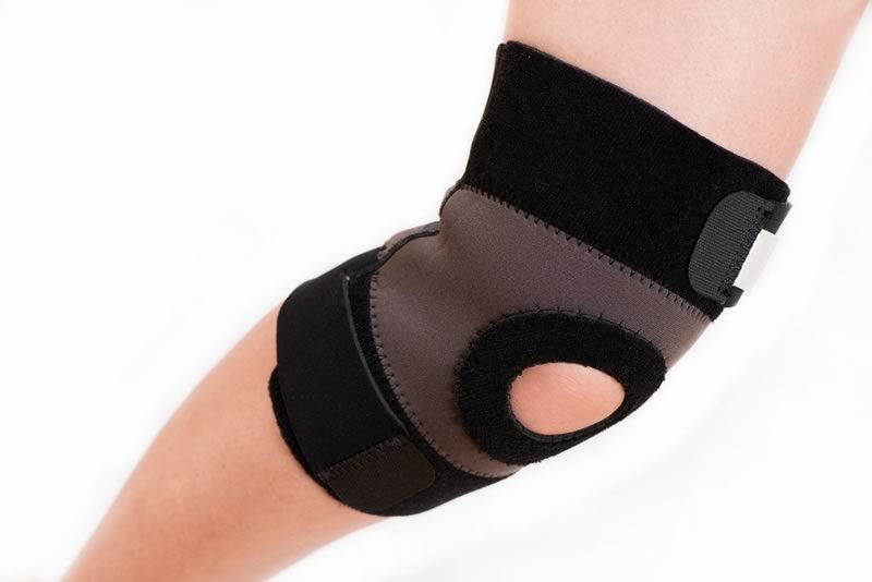 Knee in a black knee brace