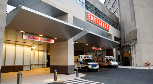 Penn State Health Milton S. Hershey Medical center emergency department entrance with two ambulances. 